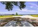 Lounge chairs on sandy beach with lake and dock views at 2519 Gabriel Rd, Fort Meade, FL 33841
