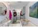 Open bathroom with an elegant soaking tub, chandelier, and custom closet at 2519 Gabriel Rd, Fort Meade, FL 33841
