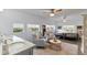 Well-lit bedroom showcasing a sitting area with natural light and a king-size bed for ultimate relaxation at 2519 Gabriel Rd, Fort Meade, FL 33841