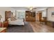 Large bedroom with wood floors, built-in shelves, and a comfortable seating area at 2519 Gabriel Rd, Fort Meade, FL 33841