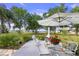 Relaxing patio with outdoor dining furniture and a view of the beautifully landscaped backyard at 2519 Gabriel Rd, Fort Meade, FL 33841
