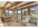 Bright sunroom featuring cozy seating, natural light, and views of the neighborhood at 2519 Gabriel Rd, Fort Meade, FL 33841