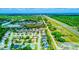 A vibrant aerial view showcasing the community with lush greenery and roadways nearby at 2626 Greenwillow Dr, Orlando, FL 32825