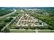 Community aerial showcasing home placement, green spaces, and nearby highway at 2626 Greenwillow Dr, Orlando, FL 32825