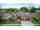 Aerial view of home showcasing roof, landscaping, and curb appeal in a well-maintained neighborhood at 2626 Greenwillow Dr, Orlando, FL 32825