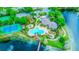 Community amenities including a pool, tennis court, and clubhouse are featured in an aerial view at 2626 Greenwillow Dr, Orlando, FL 32825