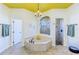 Bright bathroom features a chandelier, large tub, and separate glass-enclosed shower at 2626 Greenwillow Dr, Orlando, FL 32825