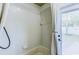 Bathroom shower with white tiles and a grab bar at 2626 Greenwillow Dr, Orlando, FL 32825