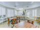 Community center seating area with tables and chairs at 2626 Greenwillow Dr, Orlando, FL 32825