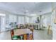 Community center seating area with tables and a kitchenette at 2626 Greenwillow Dr, Orlando, FL 32825