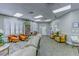 Community room with seating, bookshelves, and a decorative rug at 2626 Greenwillow Dr, Orlando, FL 32825