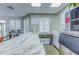Community center kitchenette with marble countertops and white cabinets at 2626 Greenwillow Dr, Orlando, FL 32825