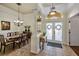 Formal dining room featuring elegant decor, stylish chandelier and tiled flooring at 2626 Greenwillow Dr, Orlando, FL 32825