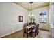 Cozy dining room featuring large arched window, elegant lighting, and neutral wall color at 2626 Greenwillow Dr, Orlando, FL 32825
