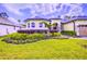 Charming home with meticulous landscaping and a well-manicured, green lawn at 2626 Greenwillow Dr, Orlando, FL 32825