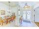 Bright foyer with double glass doors and an elegant chandelier at 2626 Greenwillow Dr, Orlando, FL 32825