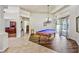 Spacious game room features a billiards table, hardwood floors and lots of natural light at 2626 Greenwillow Dr, Orlando, FL 32825