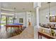 Spacious game room with pool table, modern lighting, and neutral decor at 2626 Greenwillow Dr, Orlando, FL 32825