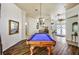 Game room features a billiards table and hardwood-look flooring, and access to the back patio at 2626 Greenwillow Dr, Orlando, FL 32825