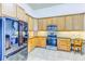 Modern kitchen features stainless steel appliances, granite countertops, and wooden cabinets at 2626 Greenwillow Dr, Orlando, FL 32825