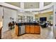 Modern kitchen with a central island, granite countertops, and seamlessly connects to the living area at 2626 Greenwillow Dr, Orlando, FL 32825