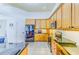 Spacious kitchen features black appliances, granite countertops, and plenty of cabinets for storage at 2626 Greenwillow Dr, Orlando, FL 32825