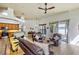 Open concept living room and kitchen featuring tile floors, ceiling fan, and lots of natural light at 2626 Greenwillow Dr, Orlando, FL 32825