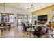 Comfortable living room with tile floors, large windows, and a cozy seating area at 2626 Greenwillow Dr, Orlando, FL 32825