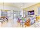 Inviting living room with tile floors, comfortable seating, natural light, and entertainment center at 2626 Greenwillow Dr, Orlando, FL 32825