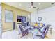 Inviting living room with tile floors, comfortable seating, natural light, and entertainment center at 2626 Greenwillow Dr, Orlando, FL 32825