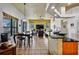 Open concept living space with large windows, tiled floors and modern lighting fixtures at 2626 Greenwillow Dr, Orlando, FL 32825