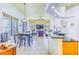 Open concept living spaces featuring views from the kitchen island to the dining and living areas at 2626 Greenwillow Dr, Orlando, FL 32825