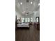 This primary bedroom features wood floors, tray ceiling, fan, and many windows at 2626 Greenwillow Dr, Orlando, FL 32825
