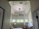 View of primary bedroom with wood floors, octagonal tray ceiling and recessed lights at 2626 Greenwillow Dr, Orlando, FL 32825