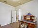 Bright home office features a dark wood desk with wood floors and a bright accent ceiling at 2626 Greenwillow Dr, Orlando, FL 32825