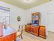 Comfortable office space includes wood-look floors, a large window, and an abundance of storage at 2626 Greenwillow Dr, Orlando, FL 32825