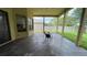 Covered outdoor patio has paved flooring with a table and chairs at 2626 Greenwillow Dr, Orlando, FL 32825