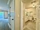Clean bathroom with a white vanity, toilet, and tile floors, accessible from the hallway at 304 E South St # 1023, Orlando, FL 32801