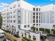 Elegant condo building with stately architecture and manicured landscaping at The Grande in Downtown Orlando, FL at 304 E South St # 1023, Orlando, FL 32801