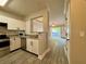 Kitchen with stainless steel appliances and a pass through to the living room at 304 E South St # 1023, Orlando, FL 32801