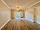 Spacious living room with modern ceiling fan and sliding glass doors to a patio at 304 E South St # 1023, Orlando, FL 32801