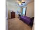 Bedroom has ceiling fan, blinds, and a desk by the window at 3301 Bethpage Loop, Mount Dora, FL 32757