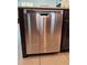 Whirlpool stainless steel dishwasher in kitchen with tile floor at 3301 Bethpage Loop, Mount Dora, FL 32757