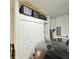 Garage with car, closet, overhead storage, and electrical panel at 3301 Bethpage Loop, Mount Dora, FL 32757