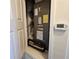 Interior shot of Lennox HVAC unit with a digital thermometer mounted on the adjacent wall at 3301 Bethpage Loop, Mount Dora, FL 32757