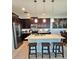 Bright kitchen featuring a large island with barstool seating and pendant lighting at 3301 Bethpage Loop, Mount Dora, FL 32757