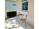 Cozy outdoor patio with a bistro table and chairs, great for relaxing at 3301 Bethpage Loop, Mount Dora, FL 32757