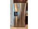 Modern kitchen features a stainless steel LG side-by-side refrigerator with water and ice dispenser at 3301 Bethpage Loop, Mount Dora, FL 32757
