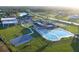 Aerial view of community amenities including a pool, basketball court, clubhouse and greenspace at 332 Blue Lake Cir, Kissimmee, FL 34758