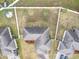 Aerial view of fenced backyard, landscaping, roof, and driveway at 332 Blue Lake Cir, Kissimmee, FL 34758